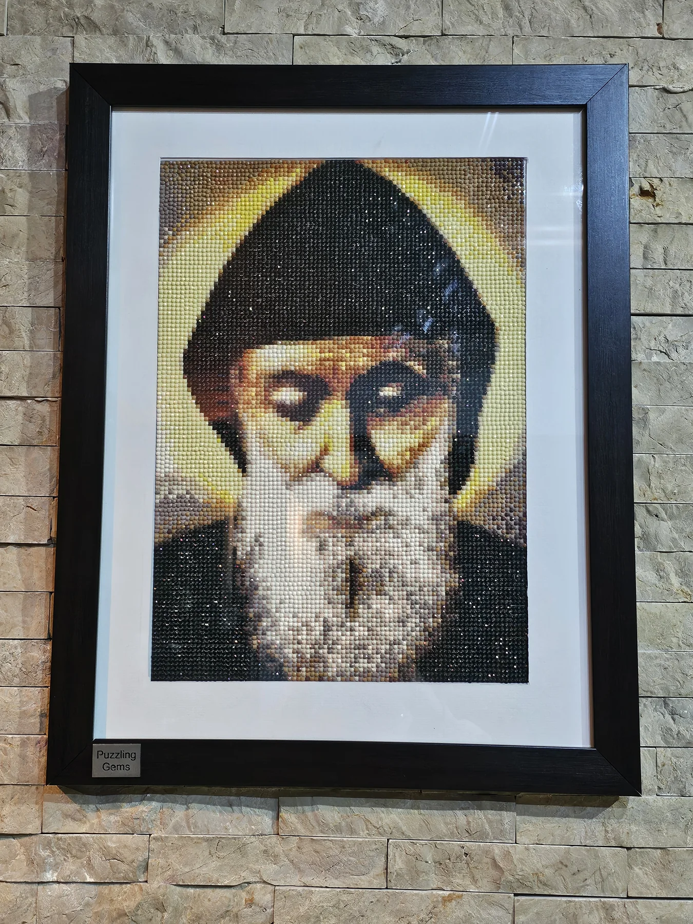 Front view of a framed Saint Charbel diamond painting portrait